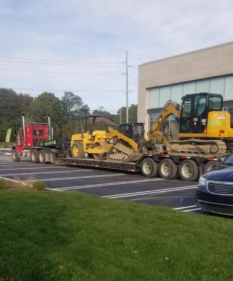 Excavator and dozer loaded for transport to a job