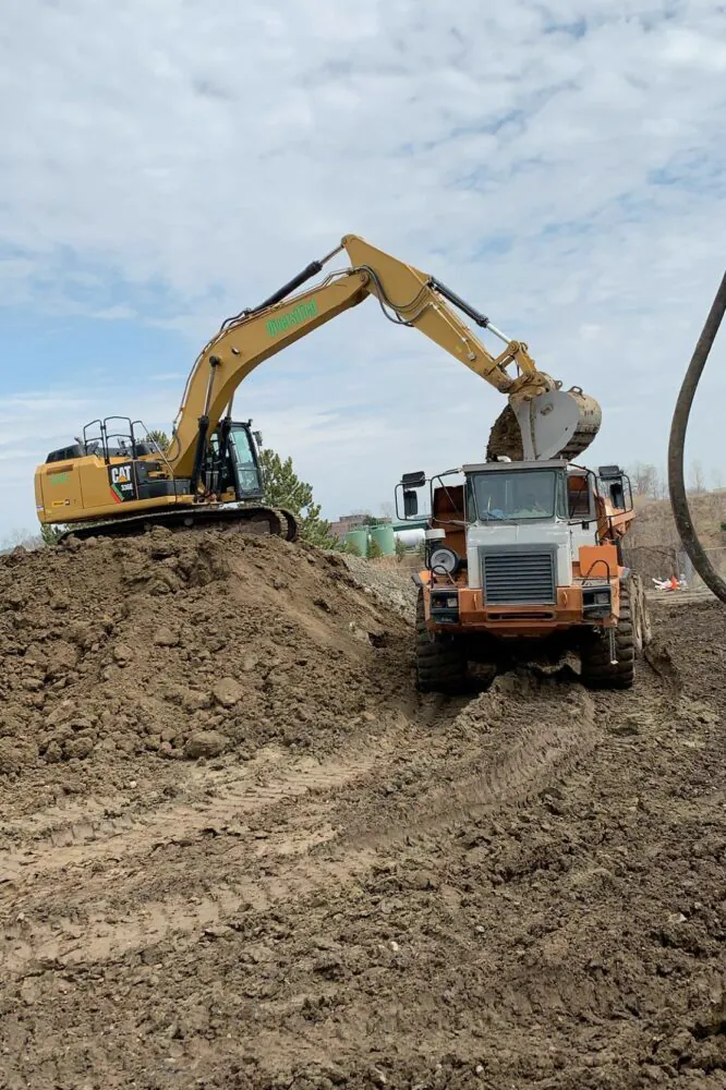 Excavator loading a haul truck