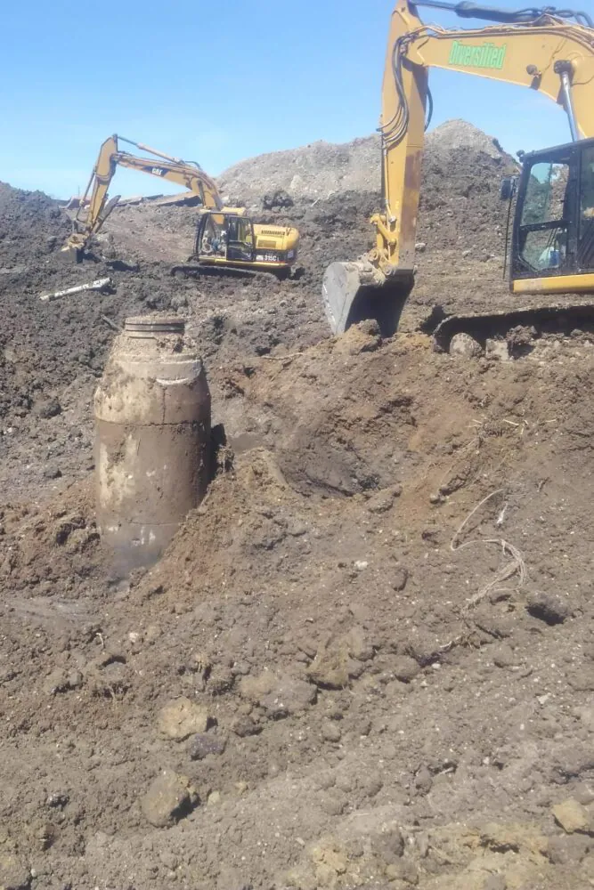 Precast structure set into an excavated pit