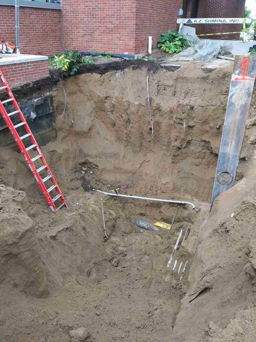 Deep foundation excavation with an access ladder
