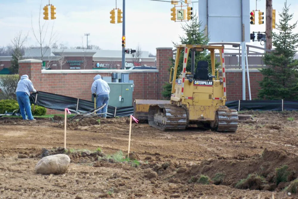 Dozer and crew working a commercial site